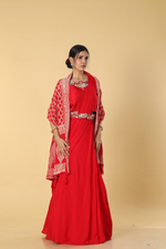 Load image into Gallery viewer, Red D-dupion resham embroidered blouse paired with georgette skirt  and embroidered banarasi bandhej cape
