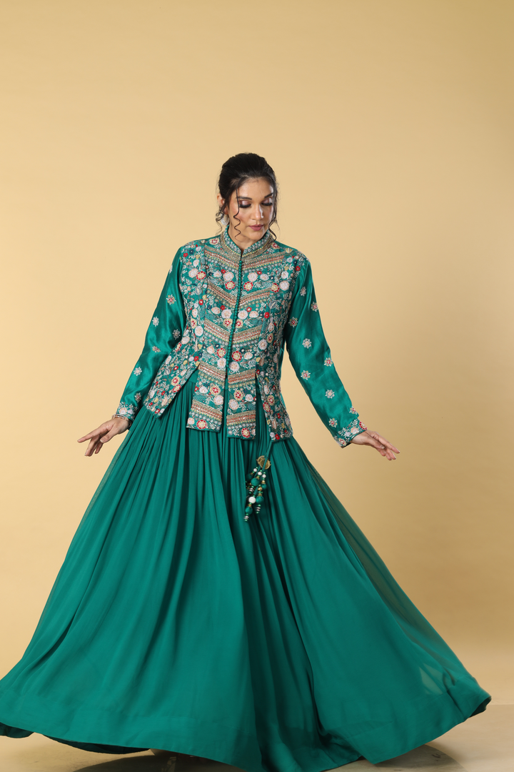 Rama green georgette pleated skirt paired with multicolour resham dola silk  jacket