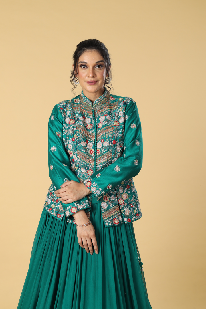 Rama green georgette pleated skirt paired with multicolour resham dola silk  jacket