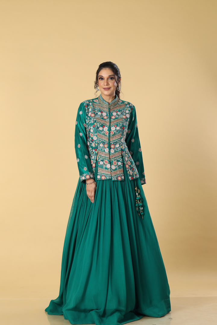 Rama green georgette pleated skirt paired with multicolour resham dola silk  jacket