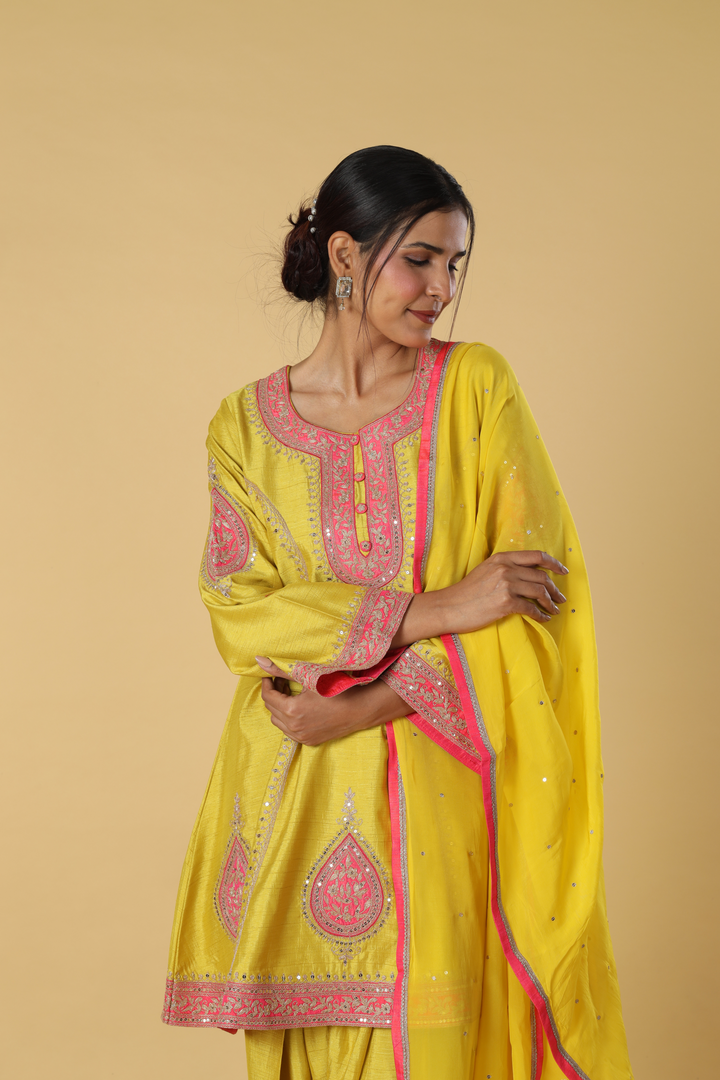 Yellow d-dupion dhoti style paired with peplum embroidered kurta and dupatta