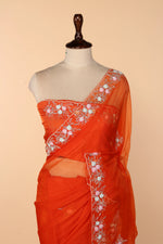 Load image into Gallery viewer, Tangerine Soft Organza Saree with Multicolour Sequin &amp; Cutdana Pearl Border
