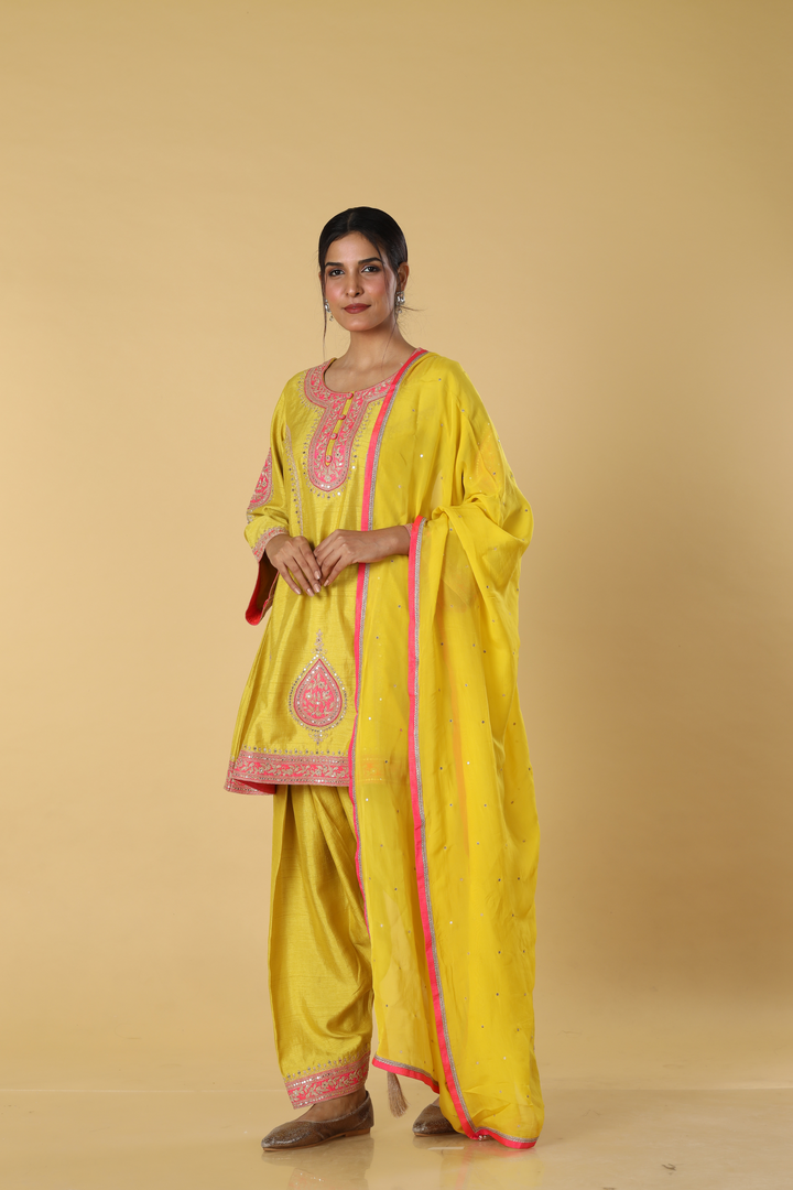 Yellow d-dupion dhoti style paired with peplum embroidered kurta and dupatta