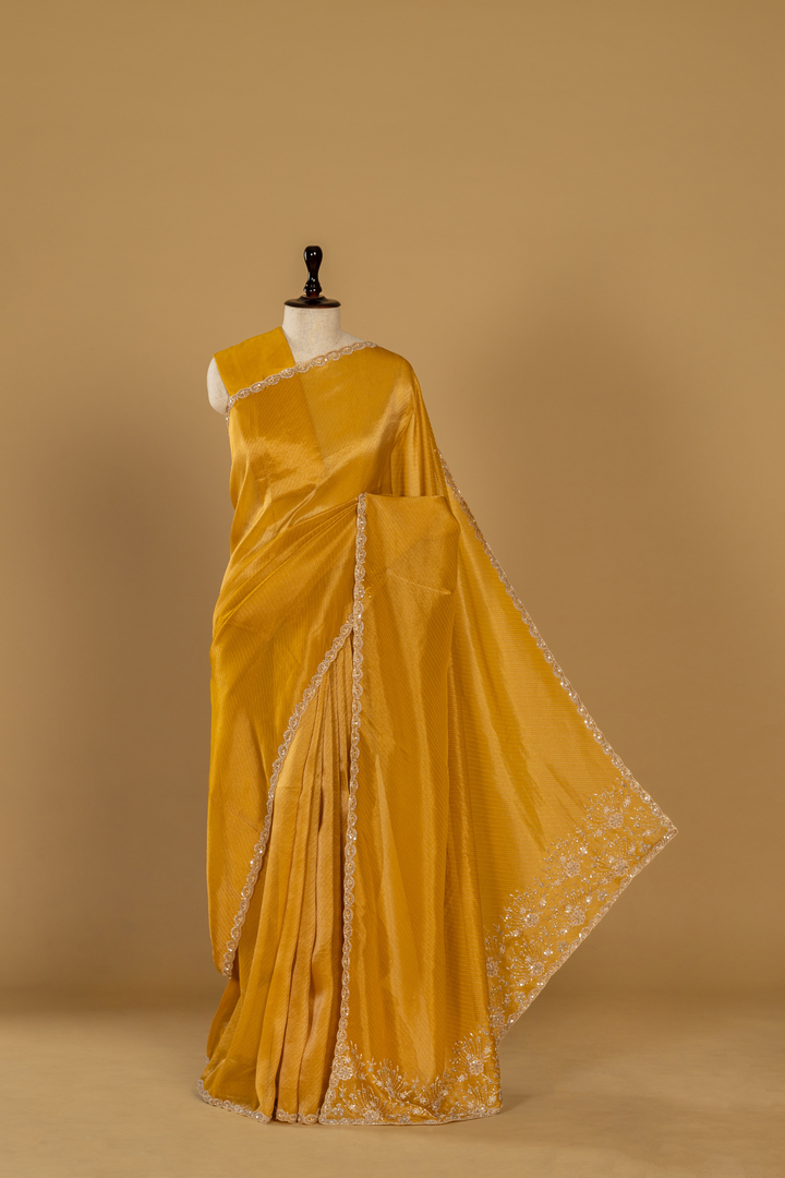 Yellow Banarasi sequence embroidery saree paired with unstitched blouse