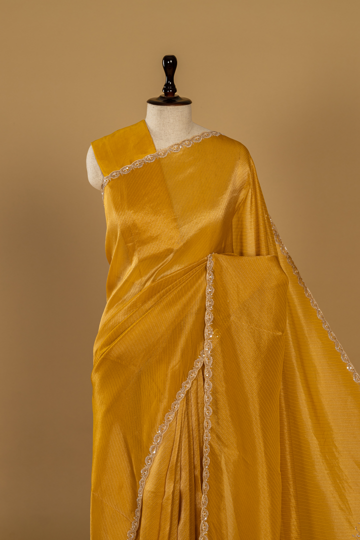 Yellow Banarasi sequence embroidery saree paired with unstitched blouse