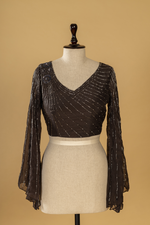 Load image into Gallery viewer, black georgette organza ruffle saree paired with bell sleeves blouse

