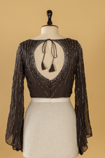 Load image into Gallery viewer, black georgette organza ruffle saree paired with bell sleeves blouse

