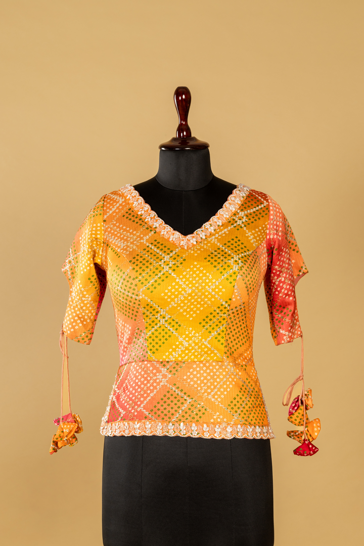 lemon yellow banarasi saree paired with designer long short contrast blouse