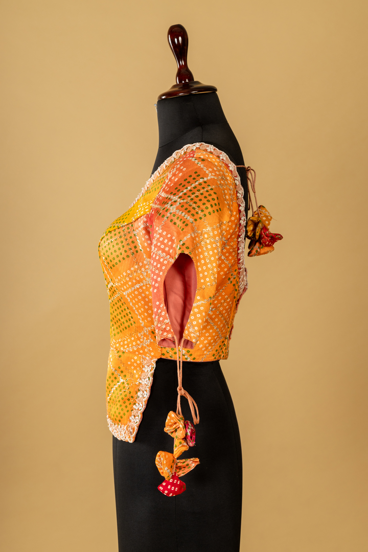lemon yellow banarasi saree paired with designer long short contrast blouse