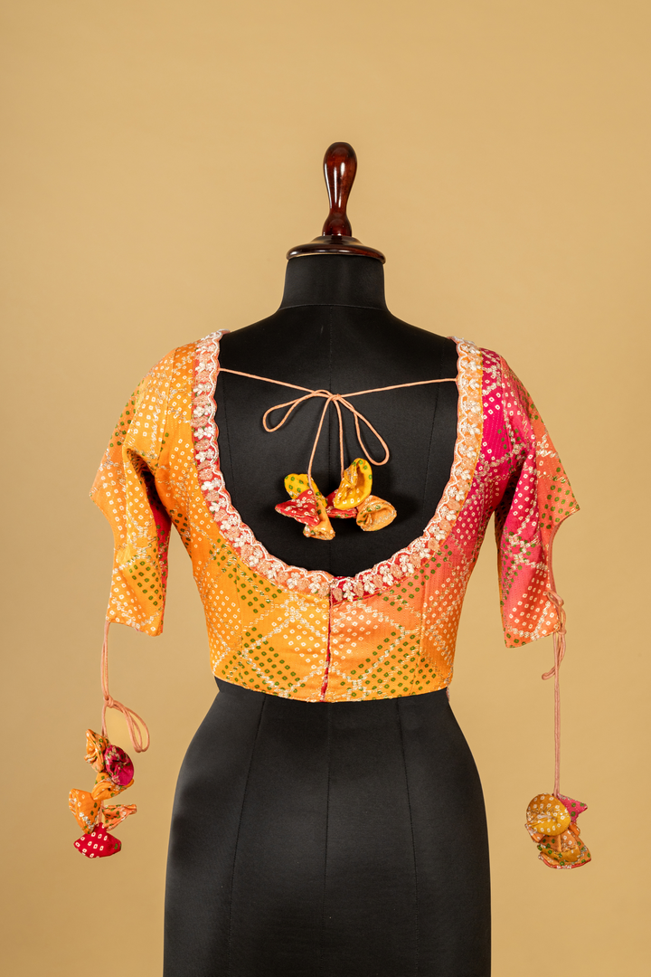 lemon yellow banarasi saree paired with designer long short contrast blouse