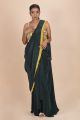 Green pre-drapped pleated saree paired with multicolour pearl work