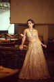 Golden sequence lehenga paired with stylish V neck blouse